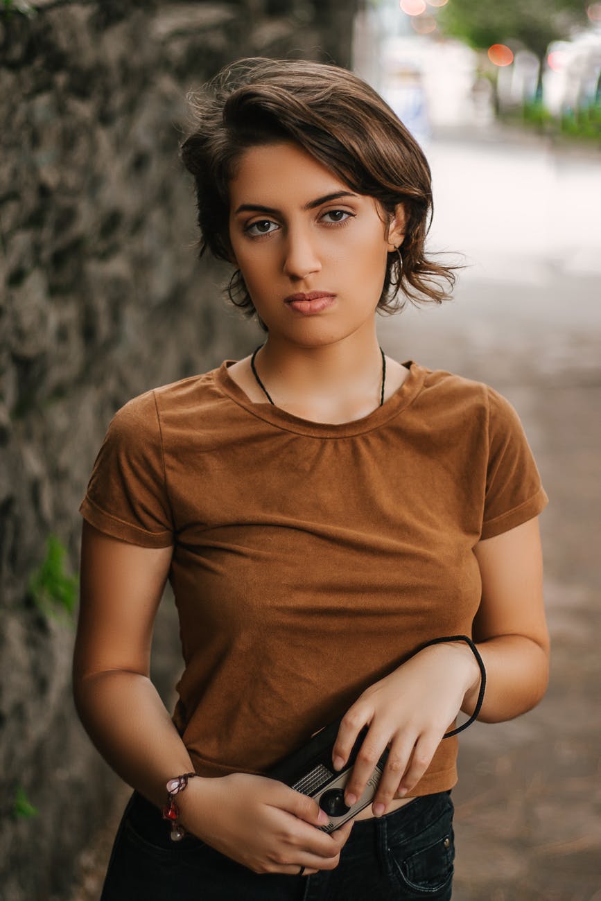 photo of girl wearing brown shirt
